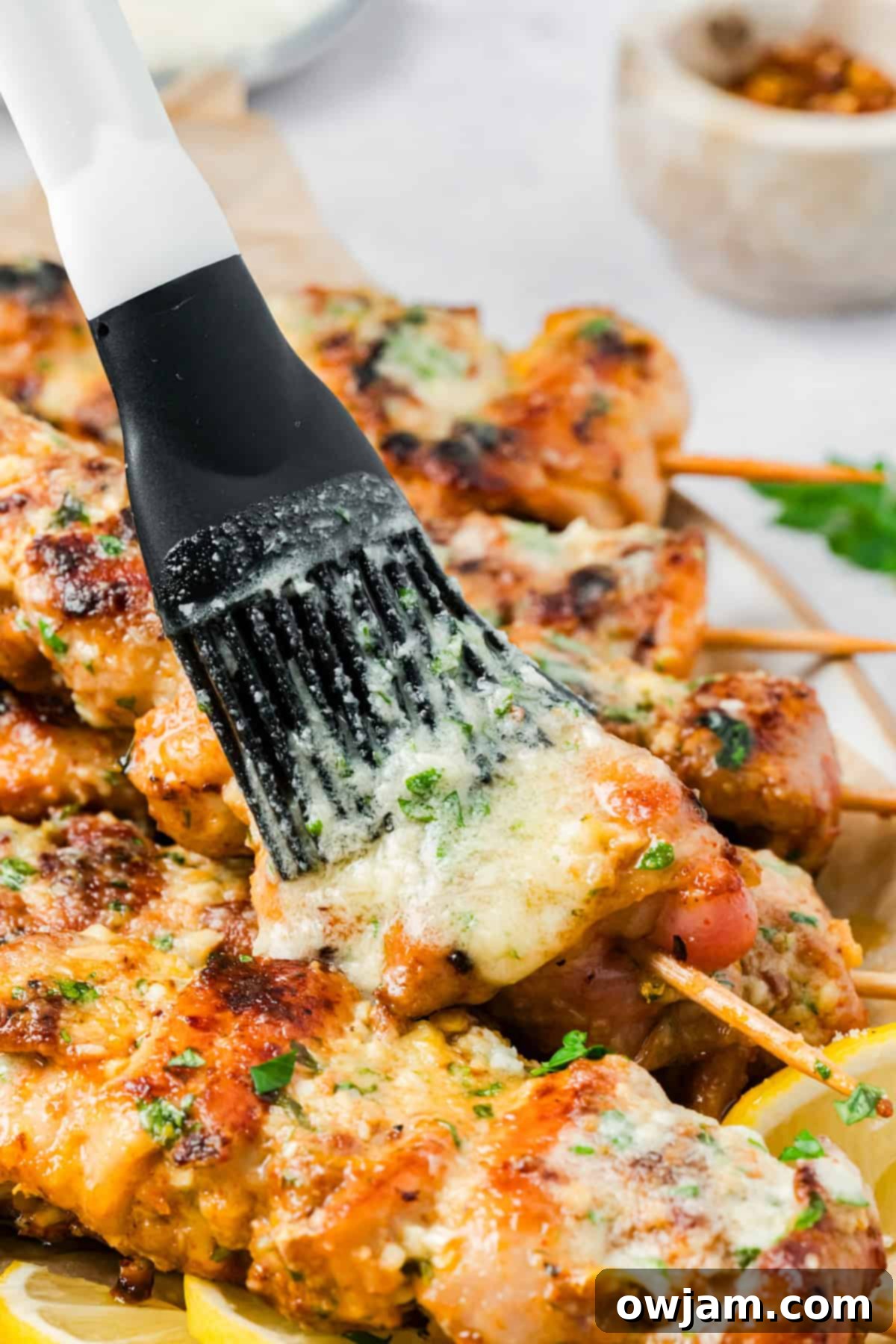 Garlic Parmesan Chicken Skewers brushed with garlic butter parmesan sauce