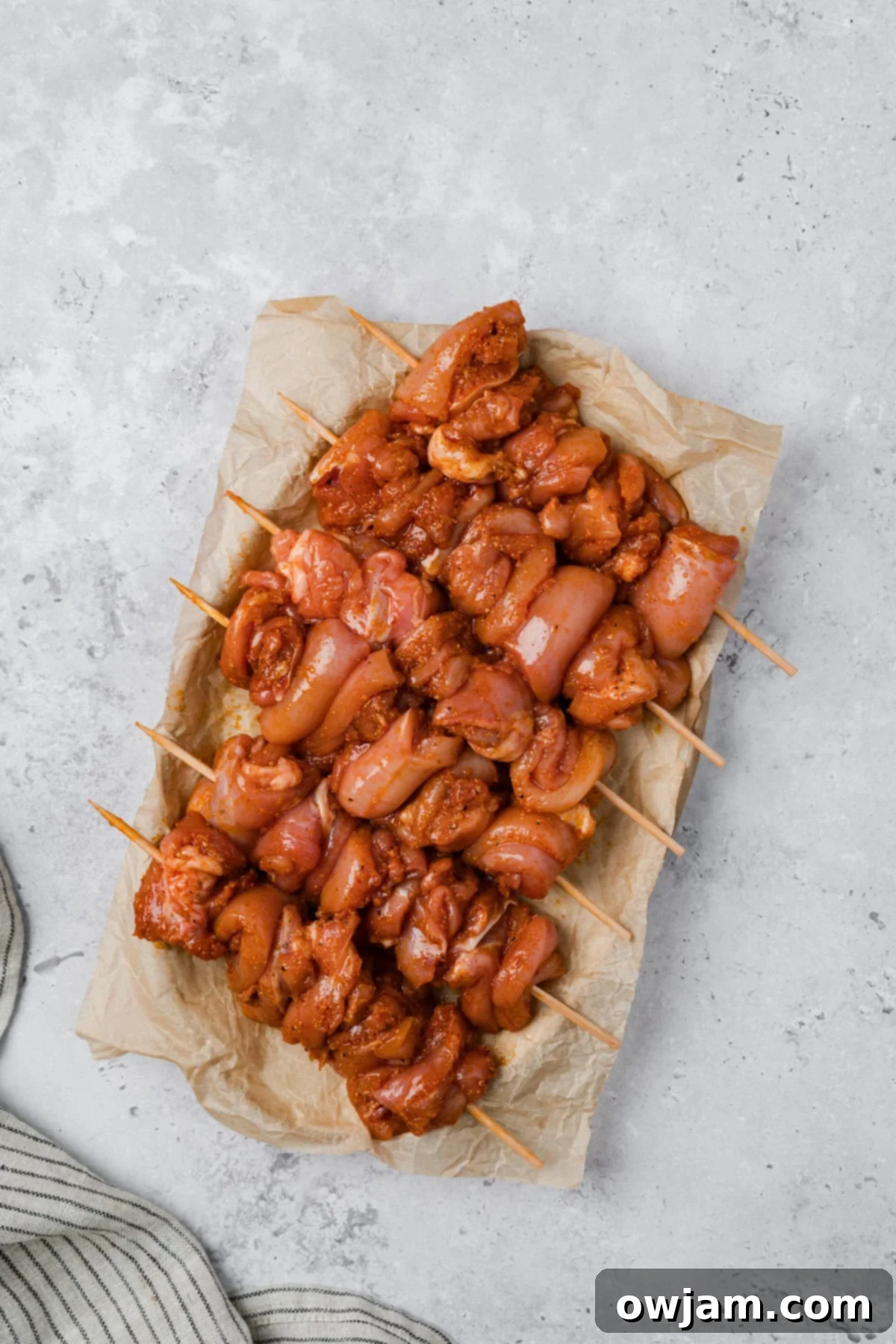 Garlic Parmesan Chicken Skewers threaded onto skewers