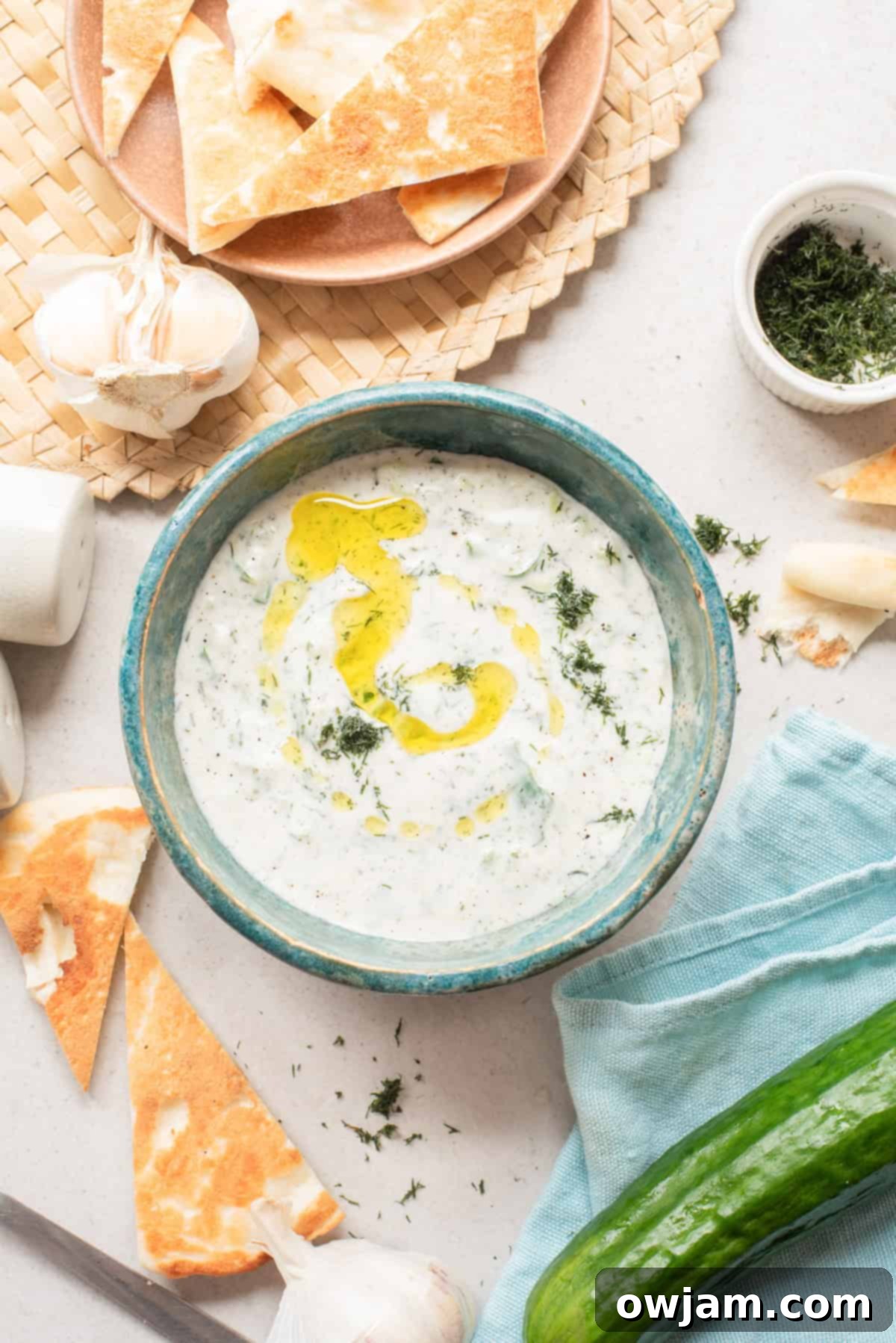 Effortless Authentic Tzatziki: A Simple Greek Delight 6 Fresh Cucumber Dill Yogurt Sauce in a blue bowl
